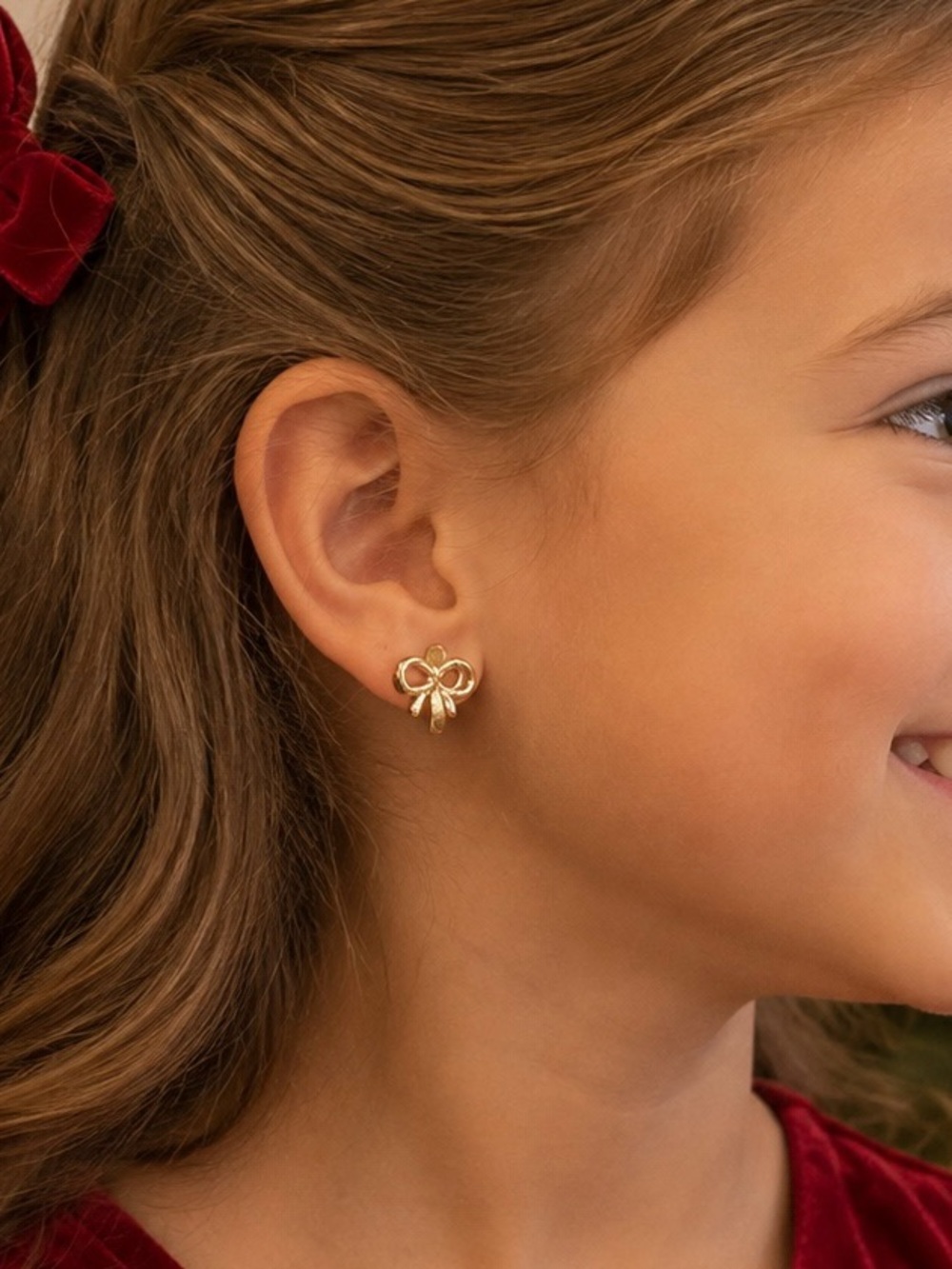 Gold bow huggie earrings new in gift bag